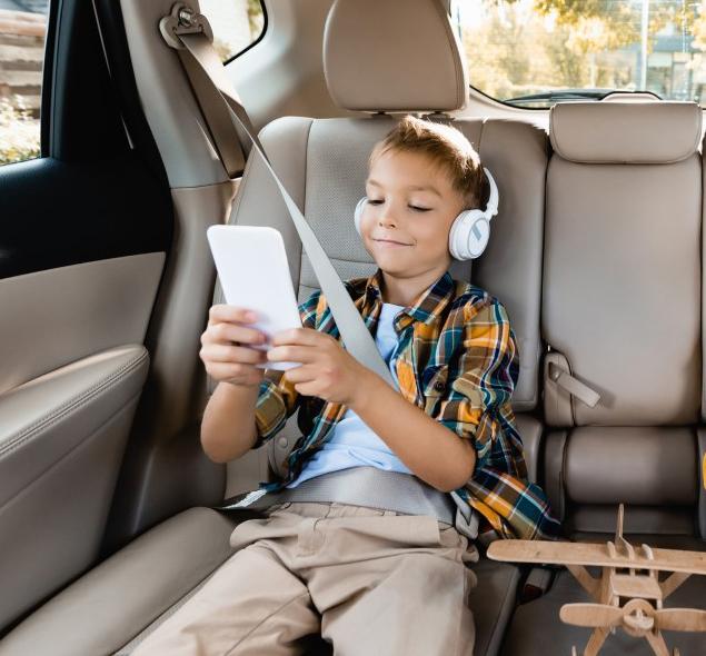 Kids in car on cell phone