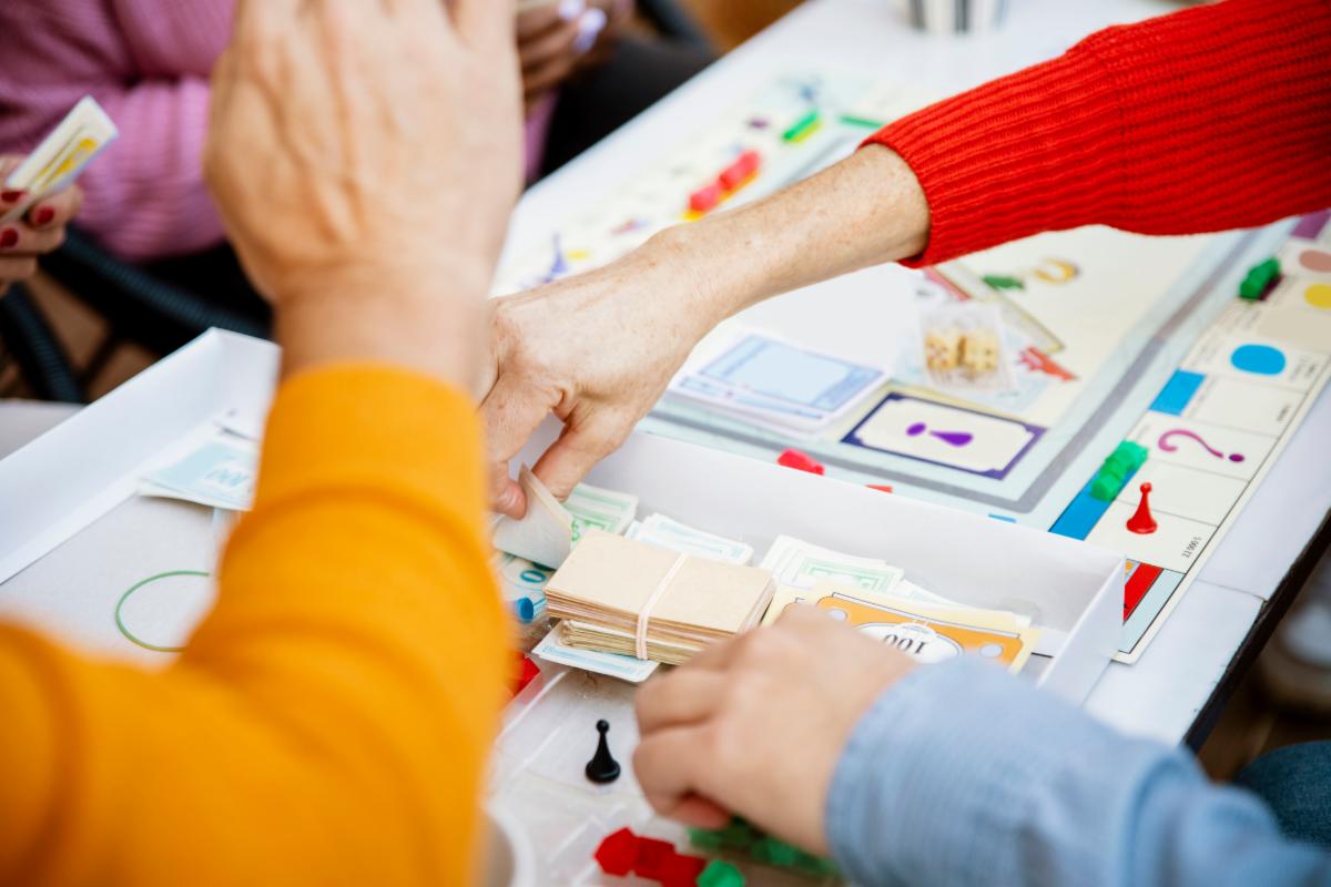 Hands playing board games