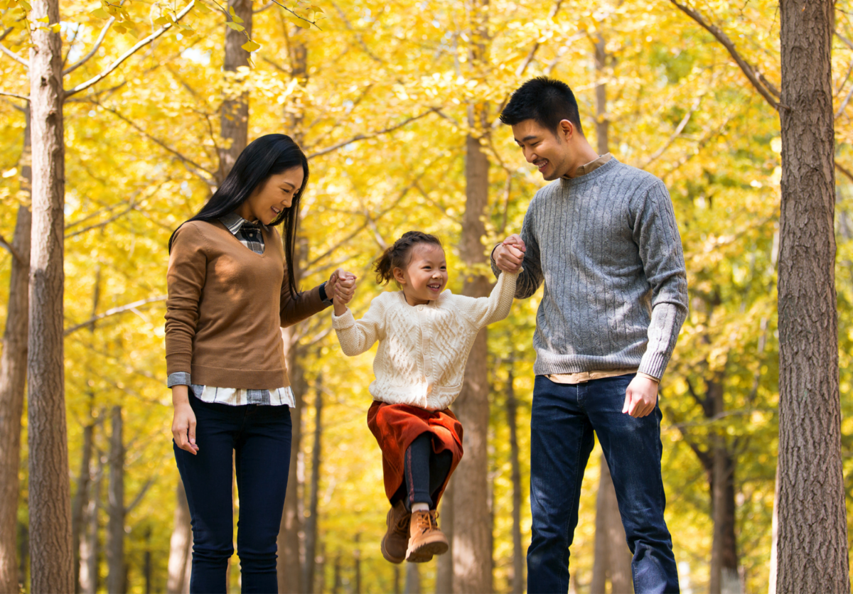 Asian American family walking in the fall