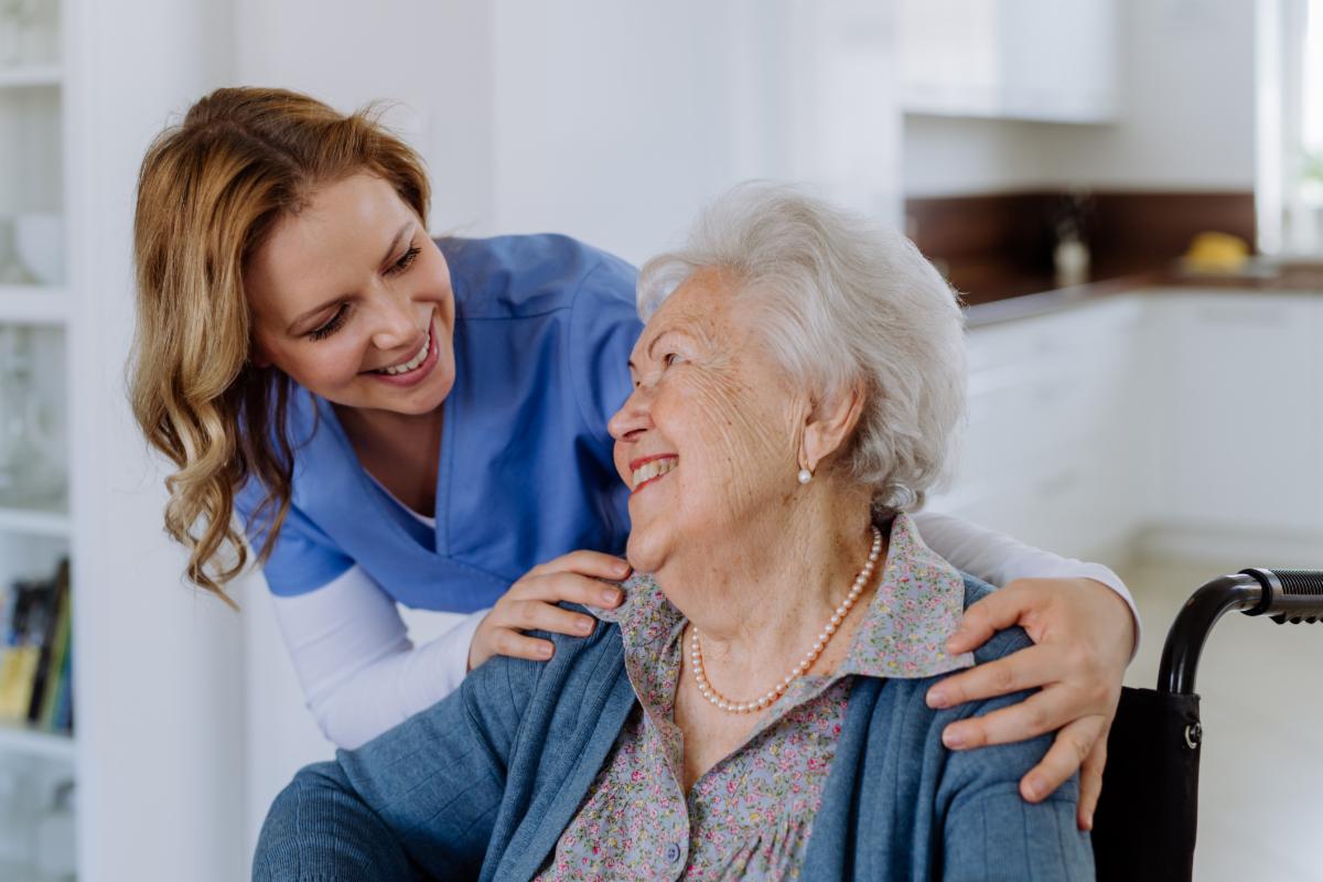 Caregiver with older adult woman 