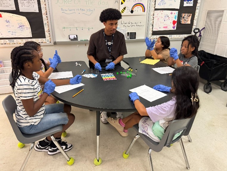 Generation Teach program participants around a table