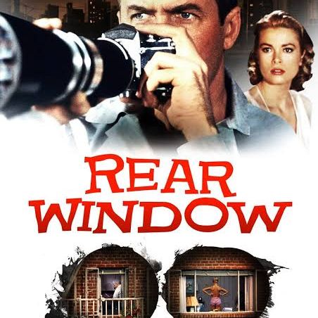 Movie poster for Rear Window, showing a man holding a large camera with a woman behind him, and two small keyhole-shaped images of neighboring windows below the title.