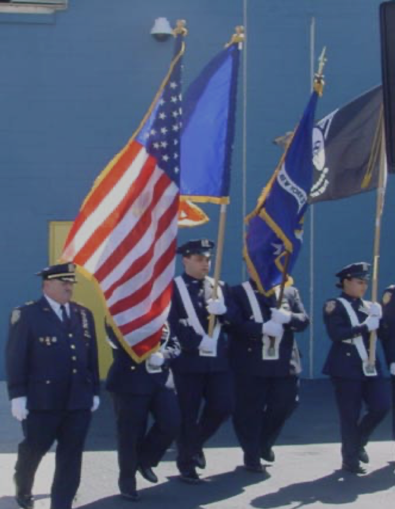 TLC Uniformed Service personnel and flags during a September 11 remembrance ceremony