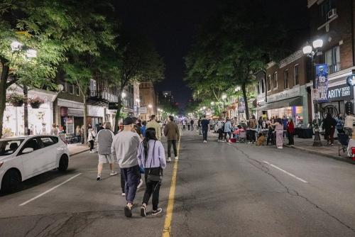 People walking down James St North during Art Crawl