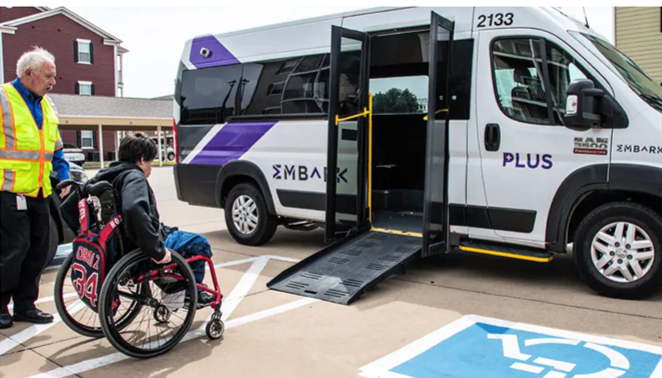 Person boarding EMBARK vehicle using ramp