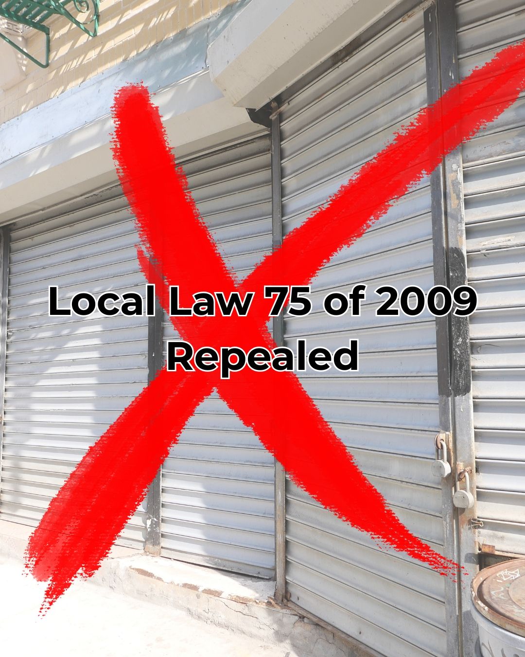 Metal storefront shutters closed with a large red X painted over and text stating Local Law 75 of 2009 Repealed