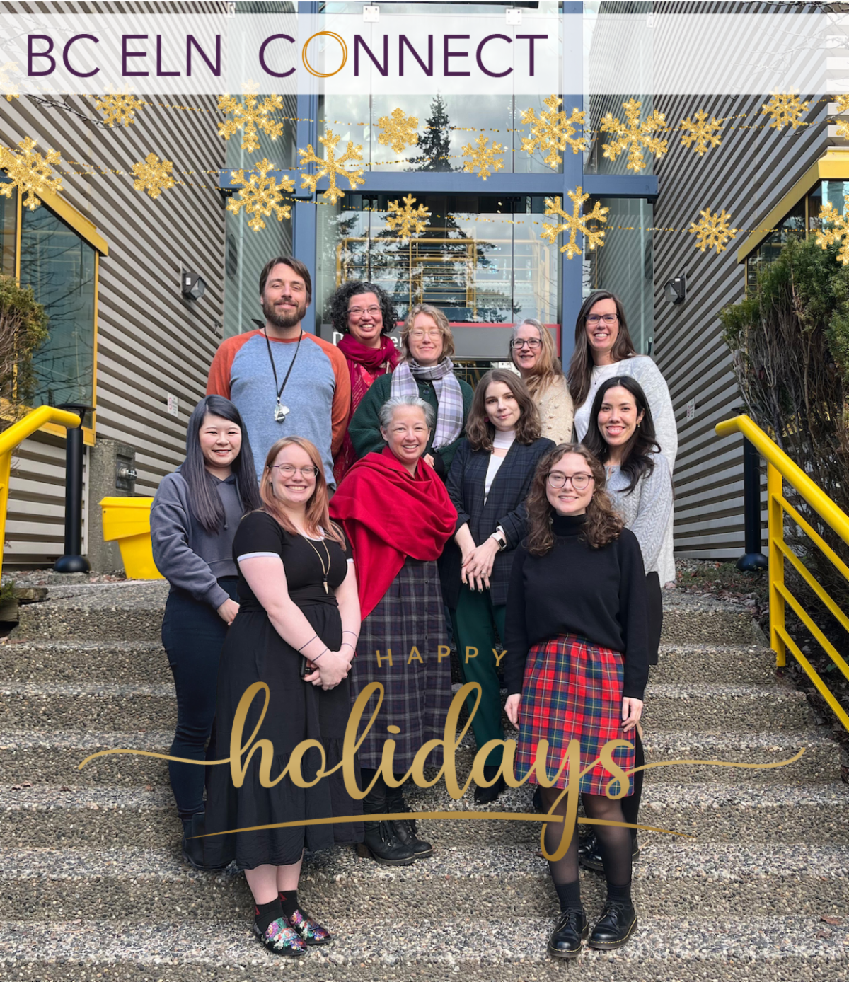 BC ELN office staff and student librarians stand on stairs outside a glass-windowed building. Garland of gold stars hangs over their heads and text overlay reads Happy Holidays