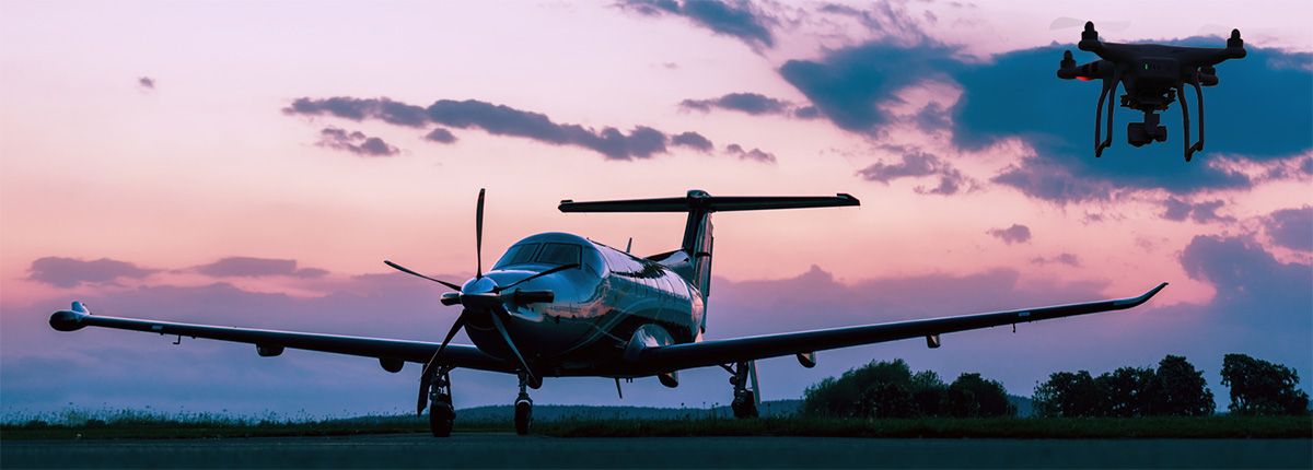 plane and drone at dawn