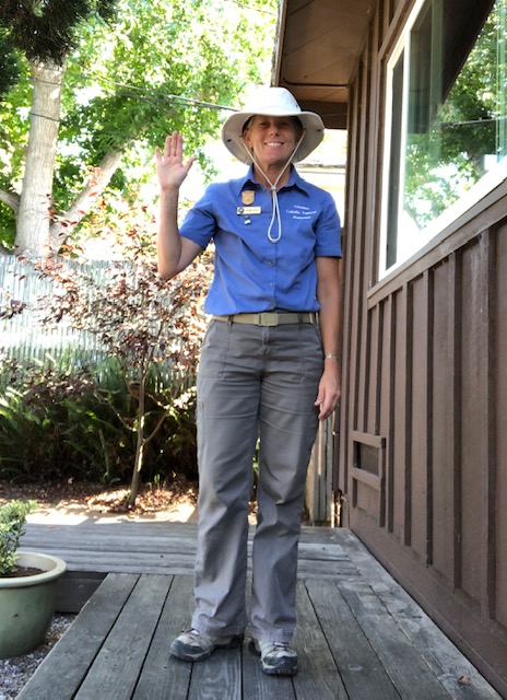  VIP Katrina waves at the camera in full VIP uniform, with a broad smile. 