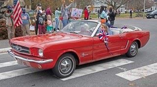Photo of a red car in the Veterans Day Car Parade