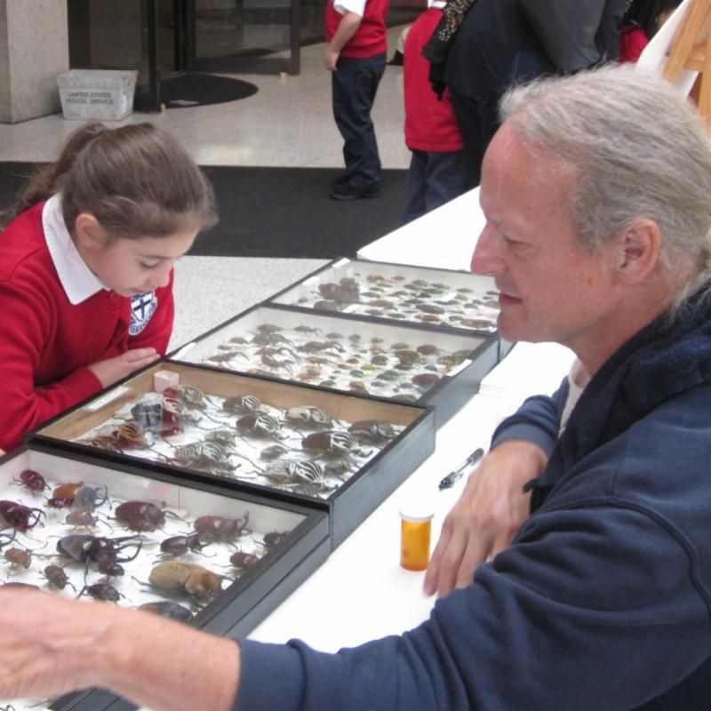 Volunteer Dana Michaud talking about bugs with students.