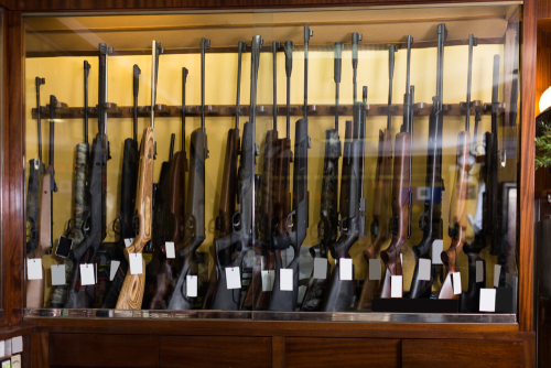 Gun store interior with rifles on showcase