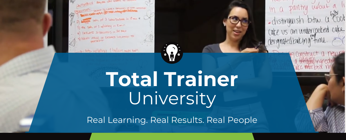 Photo of a Total Trainer participant presenting in front of a group of people.
