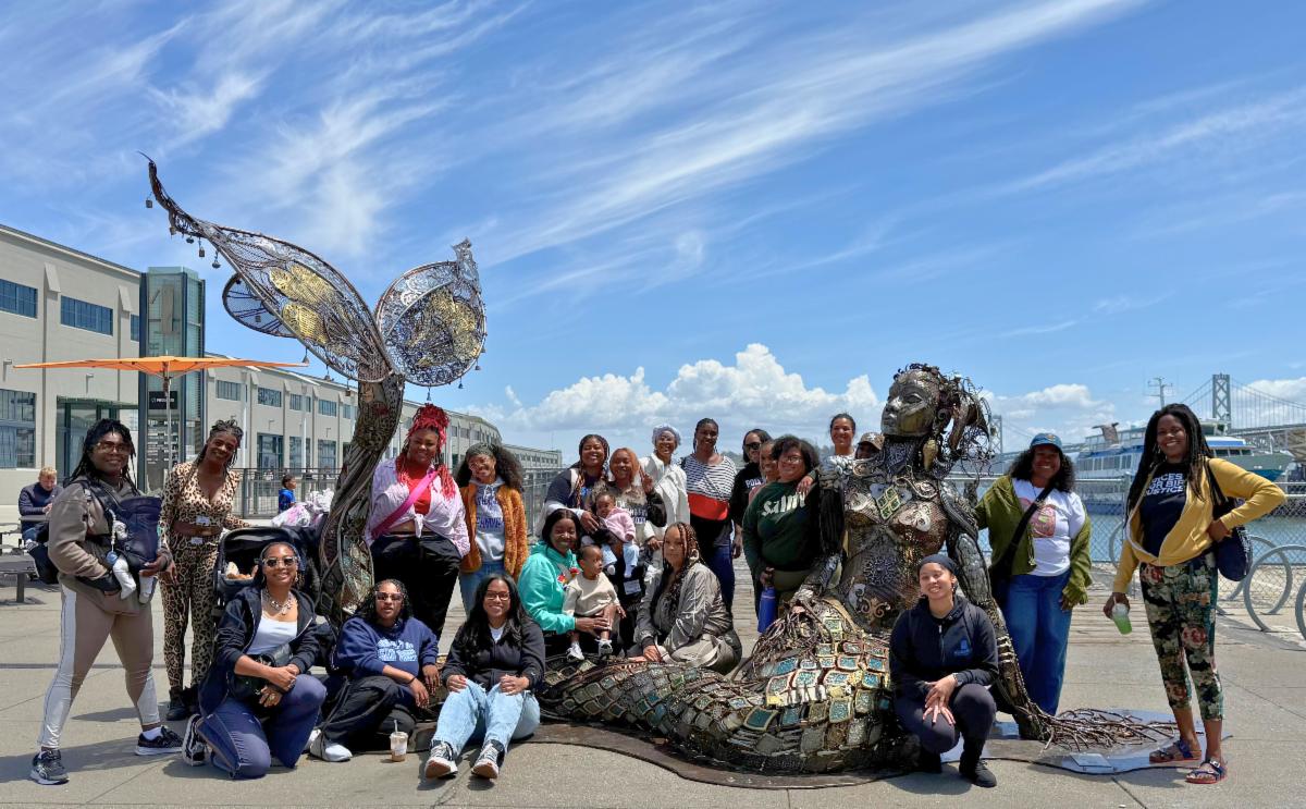 CBJ, SisterWeb, and moms pose in front of the SF Embarcadero