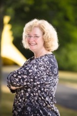 Woman smiling wearing glasses