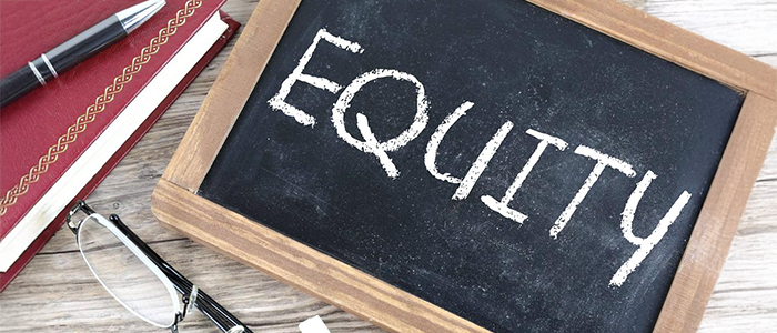 the word equity written on a chalkboard