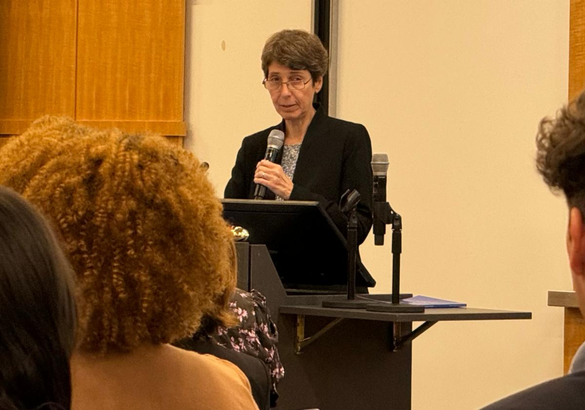 Jennifer Mathis white woman at podium