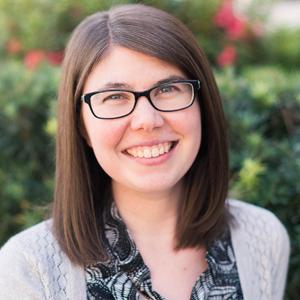 Molly Tucker white female with glasses smiling