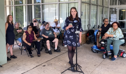 Law Center attorney fellow Madison Gray speak at a press conference following the news