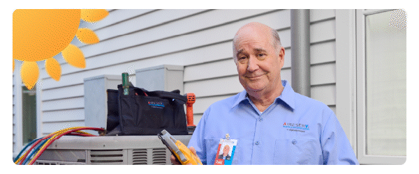 a man in a blue shirt standing by an AC unit with a cartoon sun in the left corner
