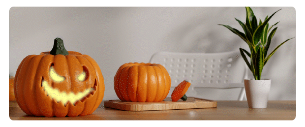 a cared pumpkin on a table for halloween