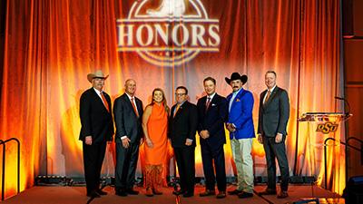 The 2026 Ferguson College of Agriculture Distinguished Alumni and OSU Agriculture Champion stand in front of Honors backdrop with Dr. Jayson Lusk.