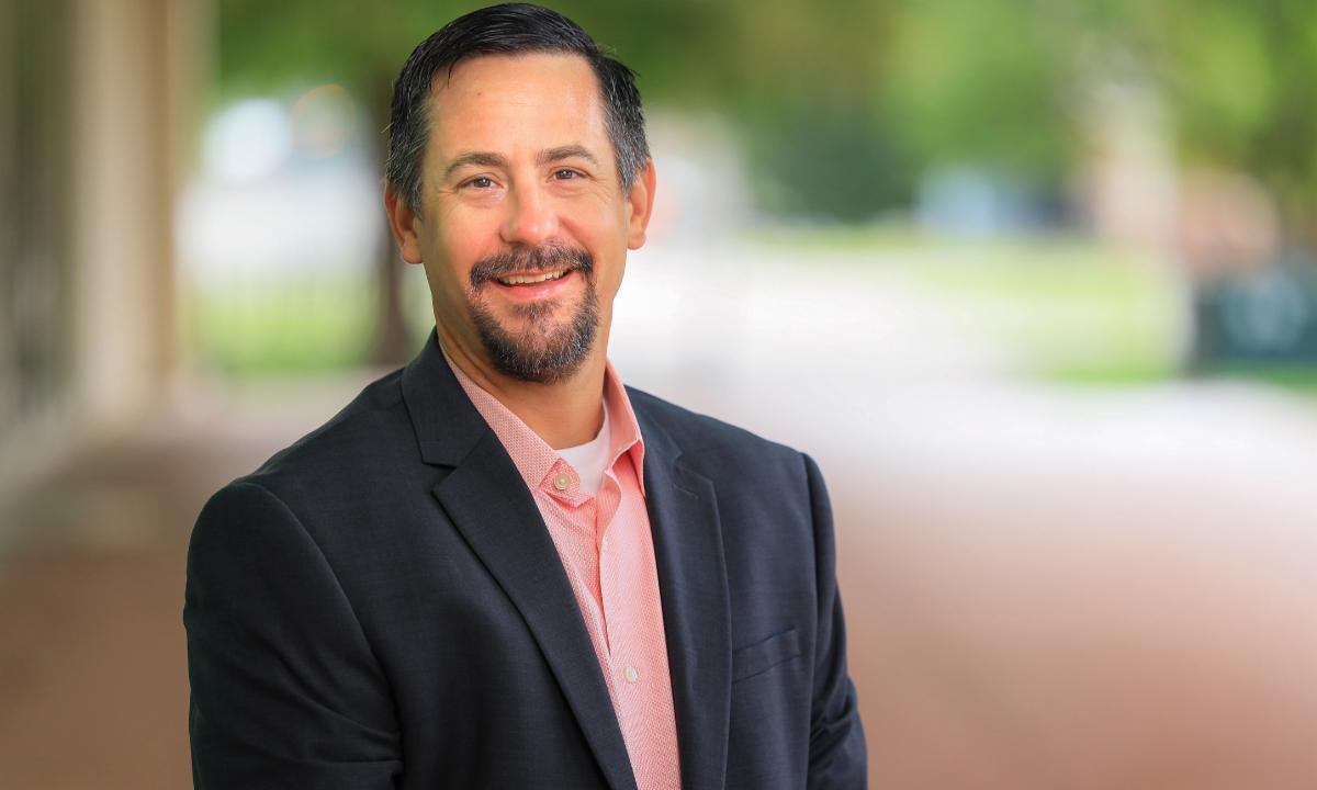 Brian Arnoll poses for a professional head shot.