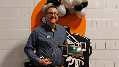 Josh Grundmann with his State Lifetime Volunteer award.