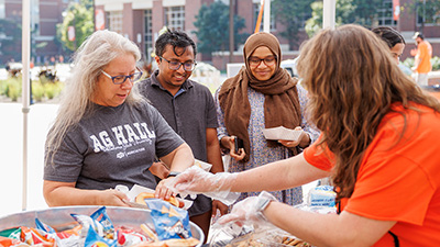 Participants stand in line for food during the Ferguson Homecoming Celebration.