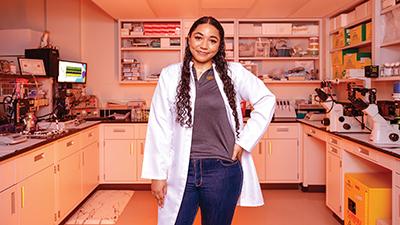 Robinson posing in a lab.