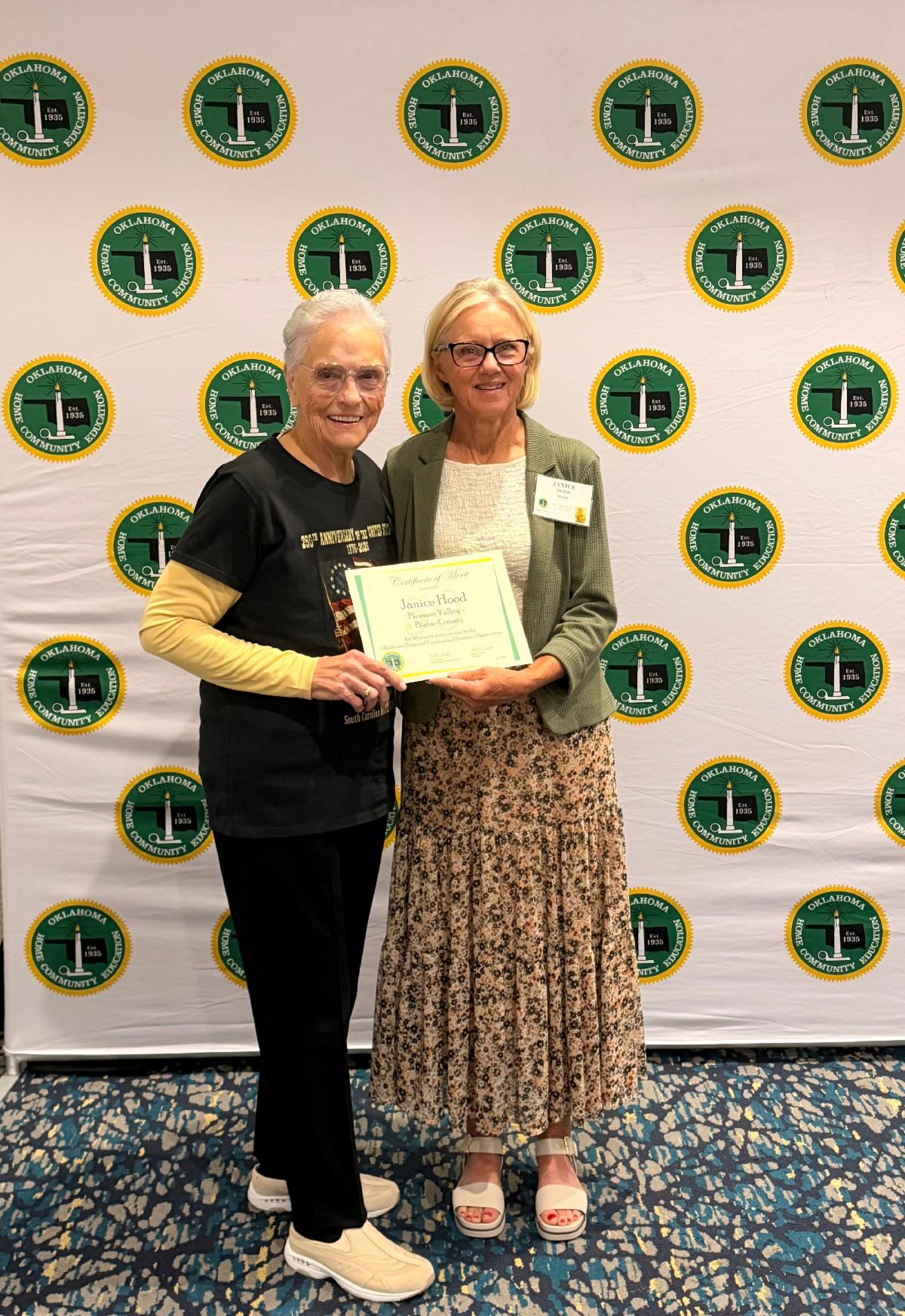 Janice Hood (right) receives recognition for 50 years of OHCE membership during the annual Oklahoma OHCE State Meeting, pictured with OHCE President Mildred Taylor.
