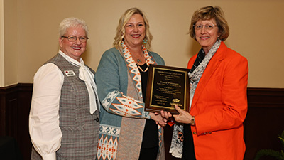 Donna Patterson receives the Distinguished Educator Award.