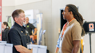 A man talked to a student during the Career Fair.