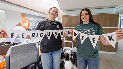 Two students holding Ferguson Week sign.