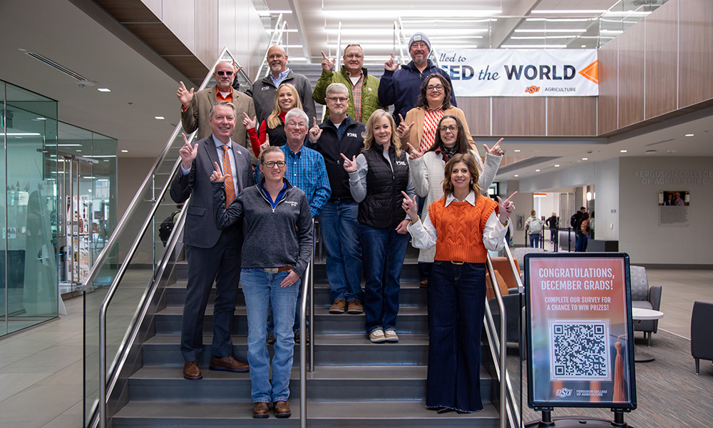 Board members of the Oklahoma Pork Council on the stairs of Ag Hall.