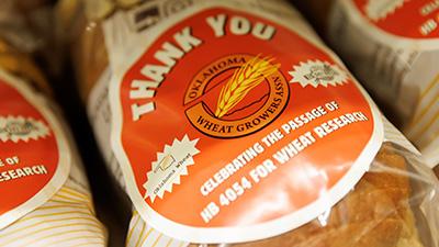 A tight shot of a bread loaf given to legislators with an orange label thanking them for passing HB 4054.