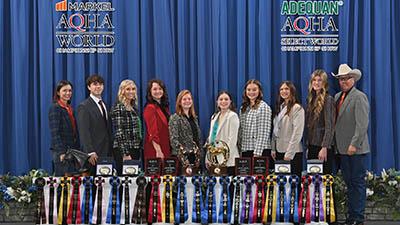 The 2025 World Champion Horse Judging Team poses with ribbons and awards.