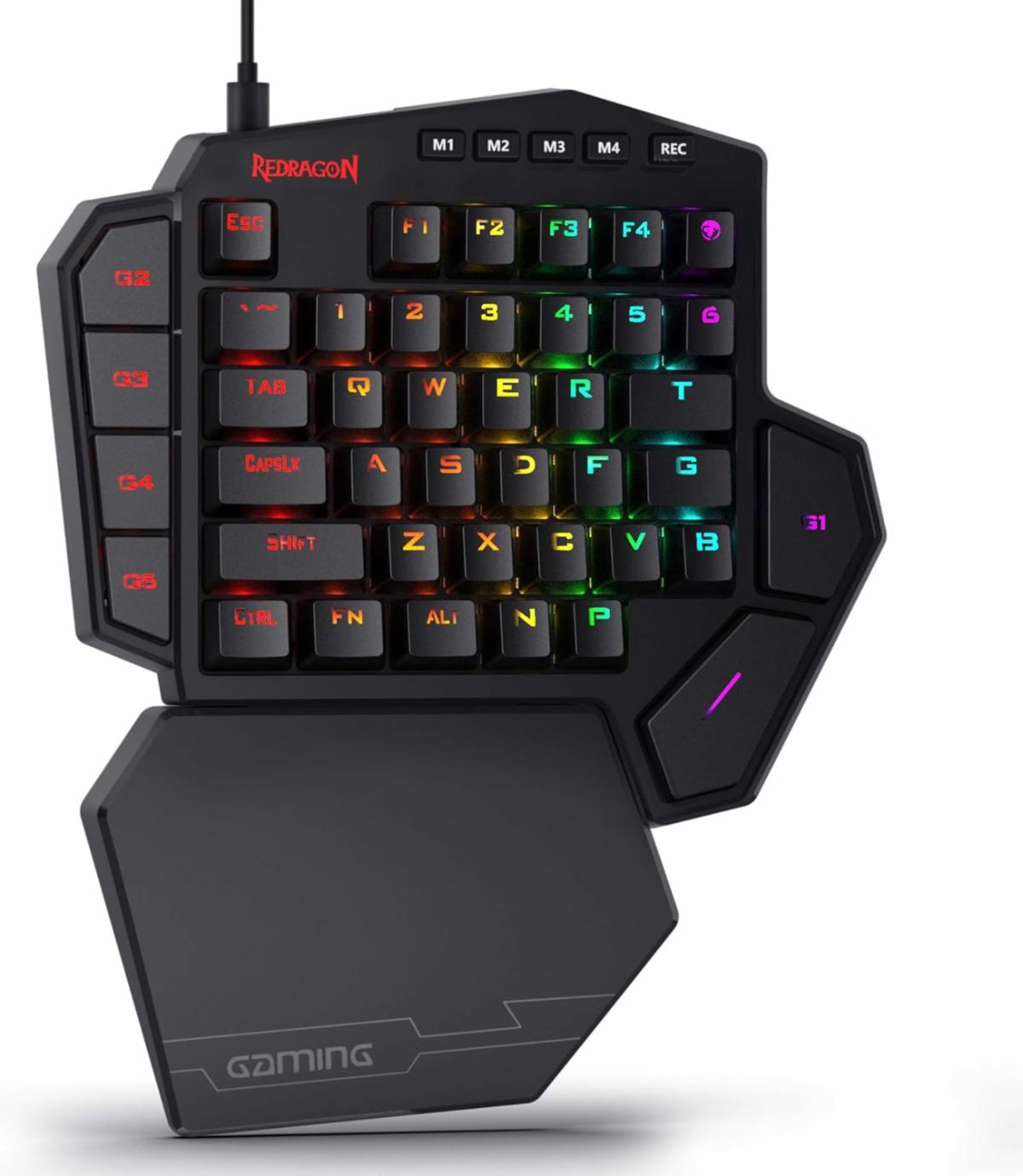 Black one-handed RGB gaming keypad with programmable macro keys, compact mechanical-style key layout, thumb controls, and an integrated wrist rest.