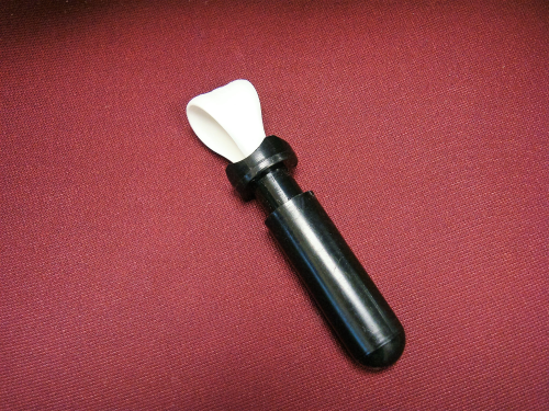 A handle with a plastic loop at one end. 