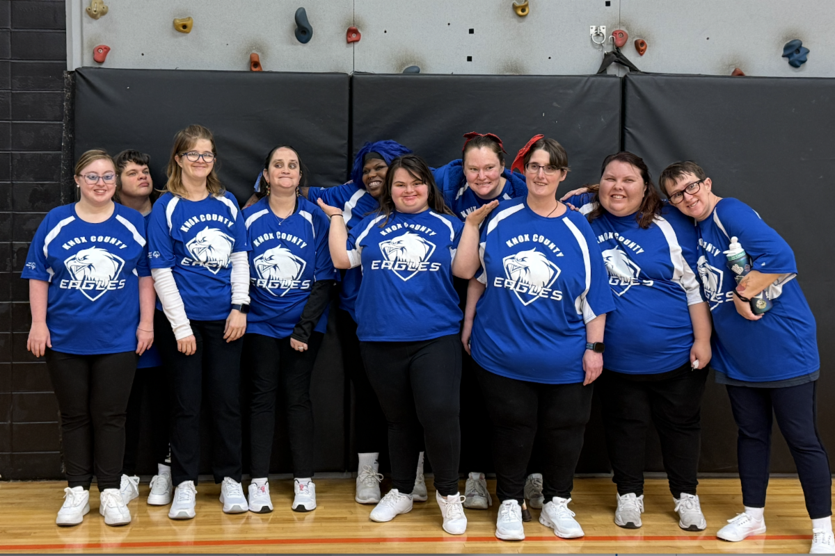 Cheerleaders in blue team shirts and black pants