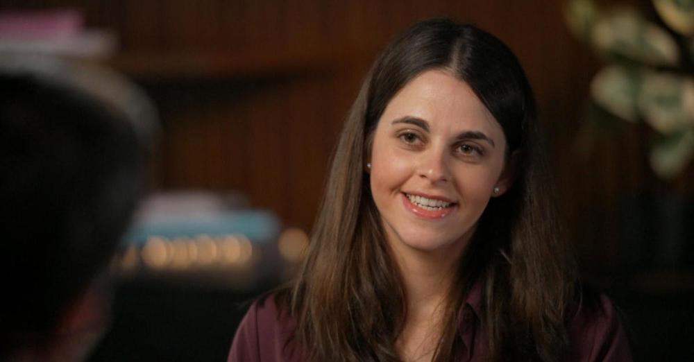 Activist, Jody Zimmerman.  A young woman with brown hair and smiling.