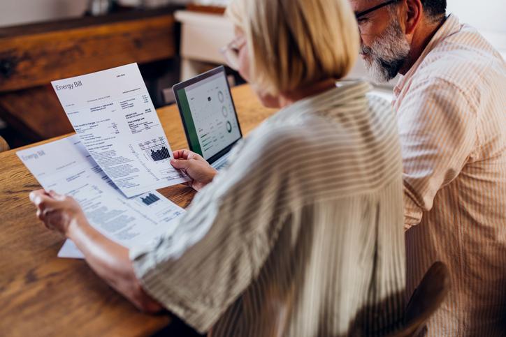 Two people review paperwork.