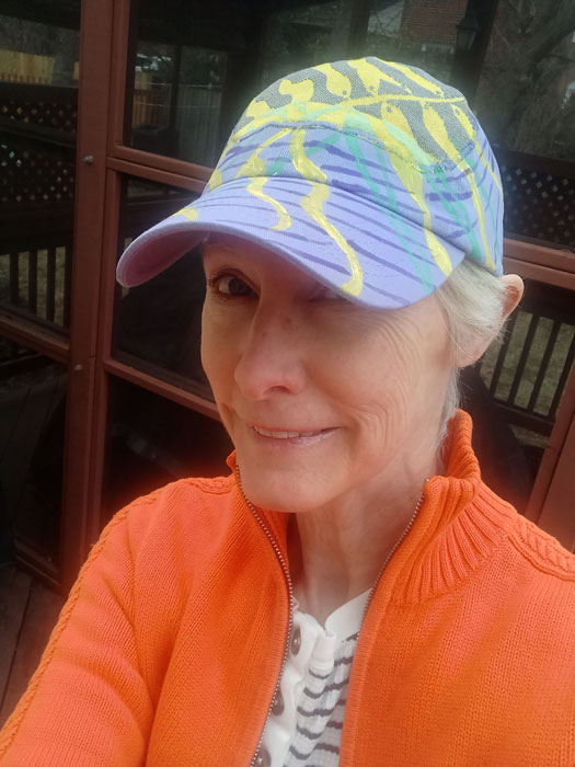 Yellow fishies on lilac baseball cap