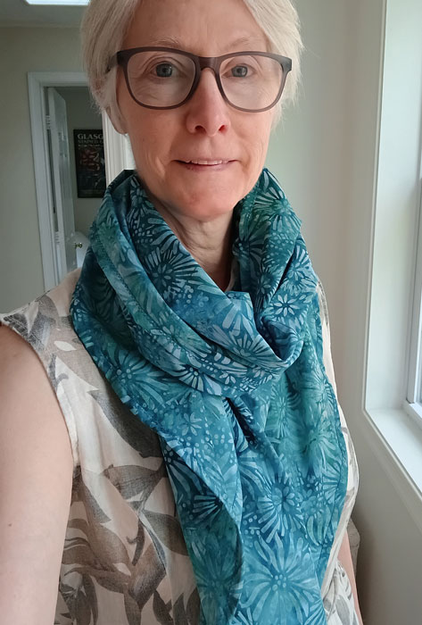 Blue batik scarf without fringe, and rounded edges
