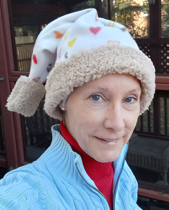 Fleece stocking cap with little hearts and faux fur accents