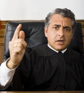 Portrait of a male judge pointing
