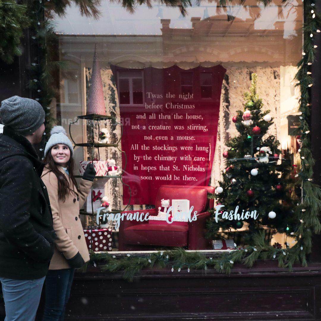Man and woman looking at window display in Port Perry store