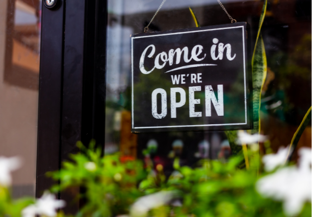 Open sign on the window of a business
