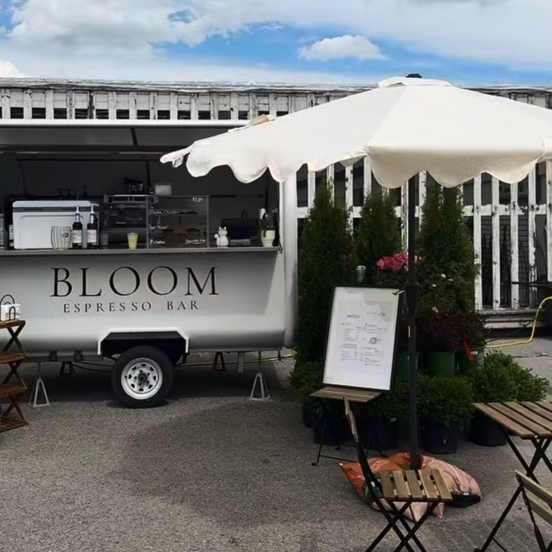 coffee truck beside a patio table and chairs