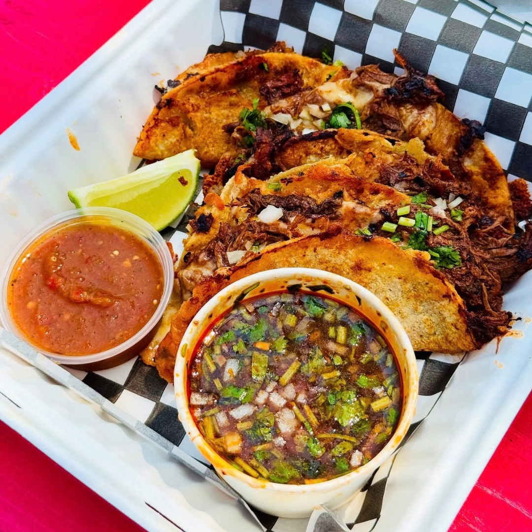tacos and salsa in a takeout dish